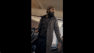 Francisco Severo Torres, seen on a plane from Los Angeles to Boston where he allegedly tried to open an emergency exit and later stab a flight attendant.