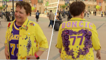 Susan Hayward from Ohio shows off her custom-made Doncic jakcet in Lakers colors.