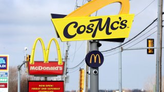 A sign hangs outside of a CosMc’s restaurant, a concept recently launched by McDonald’s on December 11, 2023 in Bolingbrook, Illinois. Lines to order food and beverages at the drive-thru-only restaurant, which opened to the public late last week, have been as long as 6 hours.