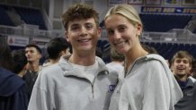 Twin siblings Liam Heaney, left, and Emma Heaney attend rehearsal for Plainview-Old Bethpage John F. Kennedy High School's graduation ceremony at Hofstra University in Hempstead, N.Y., on Tuesday, June 17, 2025. (AP Photo/Philip Marcelo)
