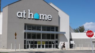 File - The entrance to an At Home store on June 16, 2025 in Miami, Florida. The home decor and furniture retailer, with more than 200 locations in the United States, is filing for bankruptcy after struggling for months amid rising tariffs.